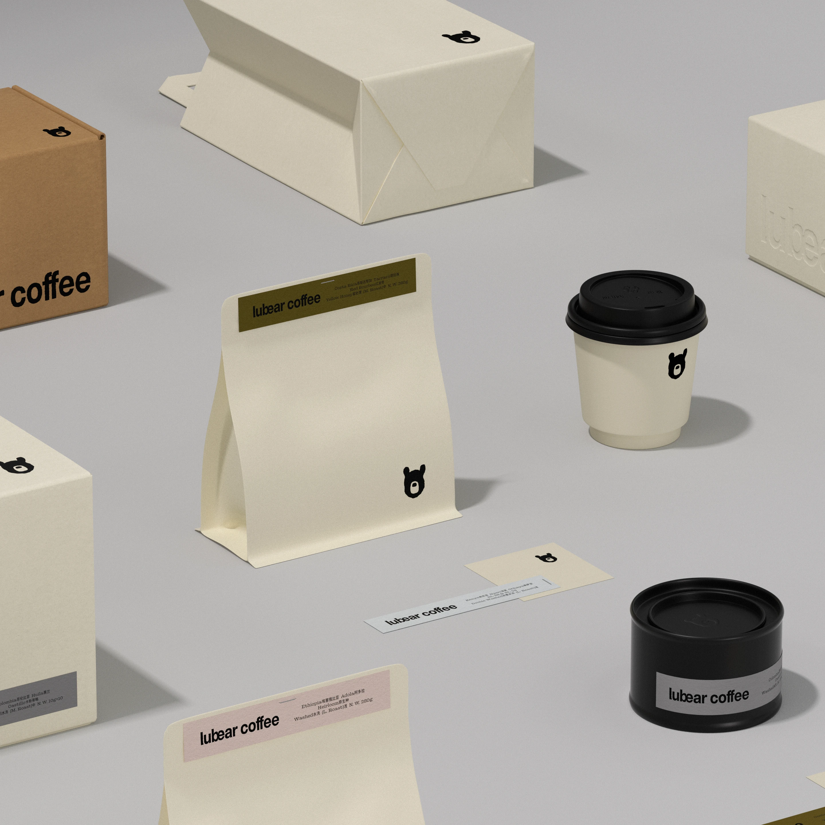 Lubear Coffee minimalist packaging and brand materials by taoSTUDIO, featuring a cream coffee bag, takeaway cup, black coffee tin, labels, boxes, and small moon bear icon.