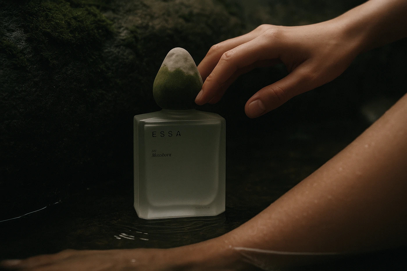 ESSA Mossborn perfume bottle photographed with natural hand interaction in water — luxury branding, product storytelling, and cinematic perfume photography trend.  08