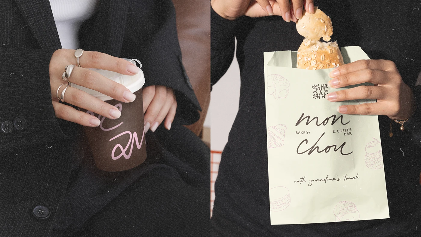 Close-up of hands holding Mon Chou’s branded coffee cup and pastel green bread bag, featuring handwritten typography and soft French illustrations that highlight the bakery’s cozy aesthetic.