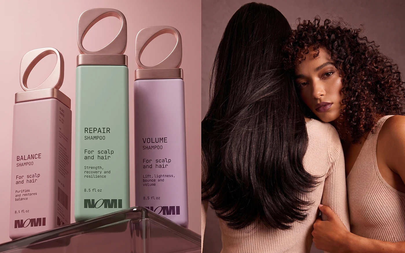 Pastel NOMI shampoo bottles displayed beside two women with straight and curly hair in a warm rose-toned beauty campaign image.