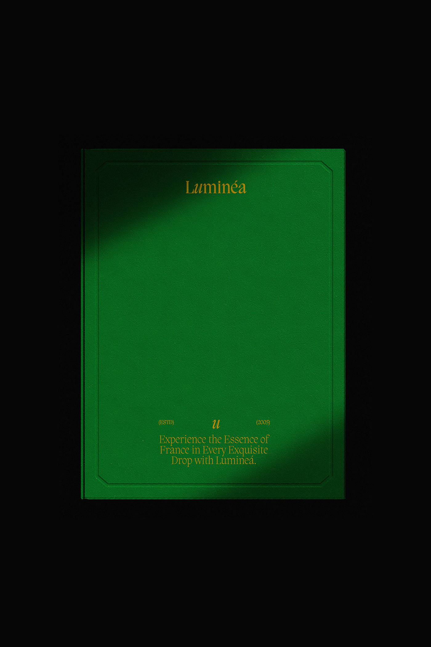 Green Luminéa brand booklet on a dark background with gold serif typography, showcasing the brand’s refined editorial identity and luxury design aesthetic.