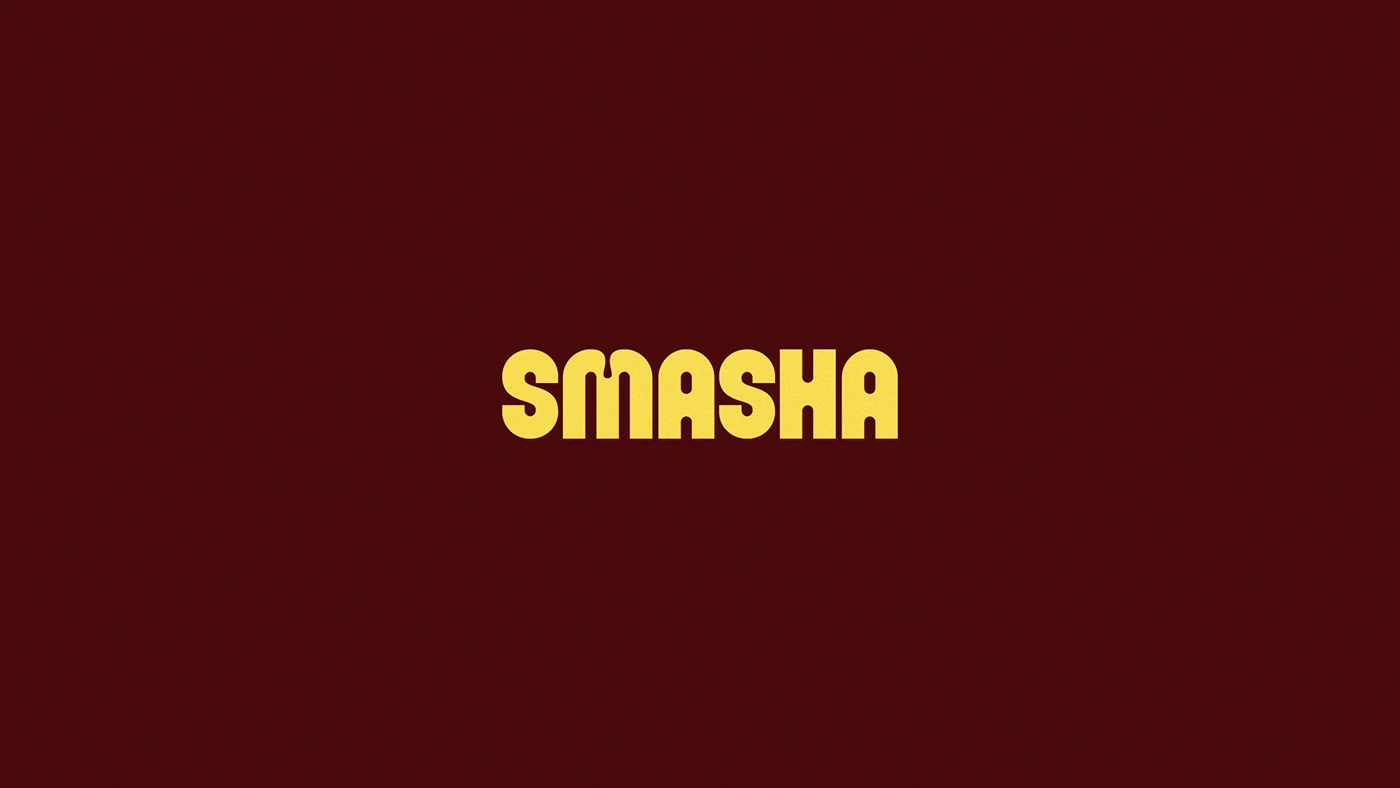 Smasha wordmark displayed on a deep red background, emphasizing strong typography and modern burger restaurant brand identity.