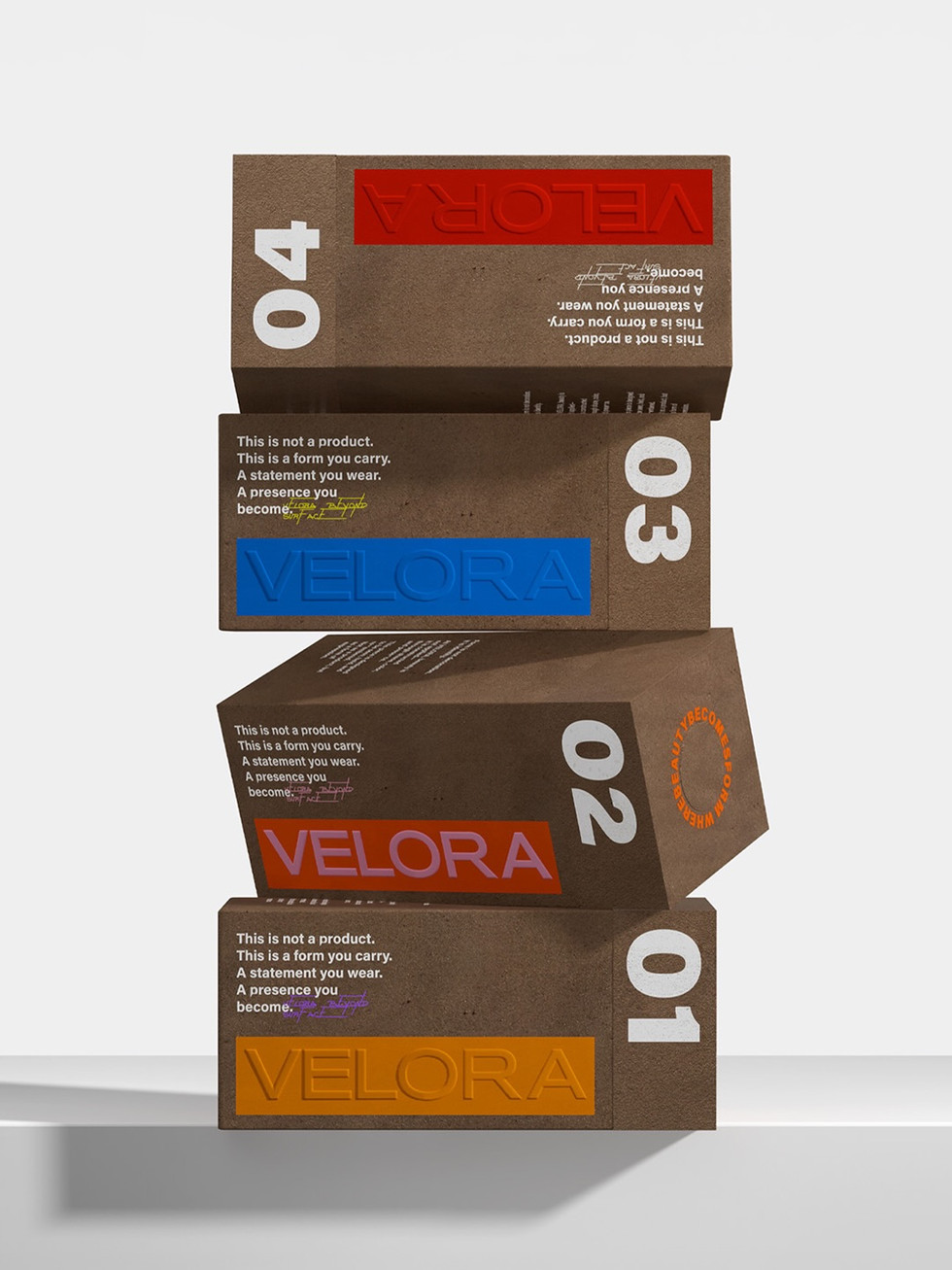 Four Velora packaging boxes in textured brown material are stacked in a balancing vertical composition, each featuring bold white numbering and embossed color logo panels.