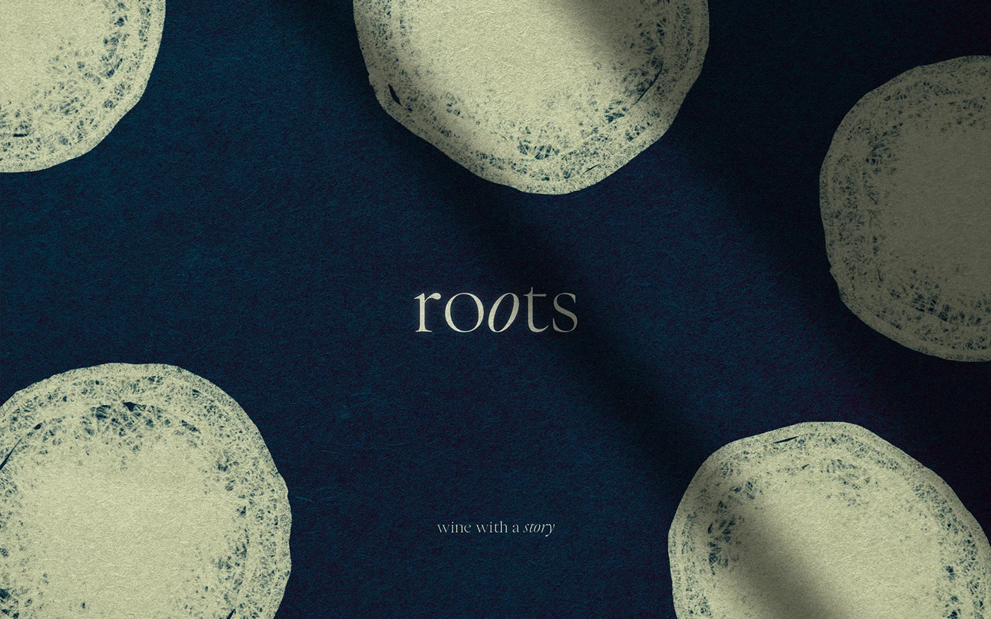 A deep slate blue digital brand background with a heavy paper-like texture, featuring the Roots logo and 'wine with a story' tagline surrounded by semi-translucent, hand-drawn white circular motifs representing grapes.