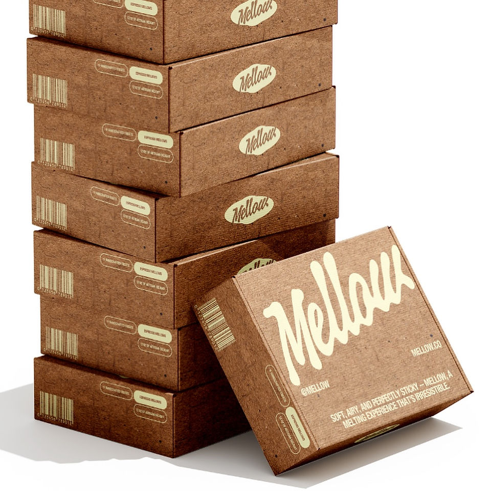 Stacked Mellow marshmallow boxes designed by WOORI STUDIOS™, highlighting natural brown paper packaging with creamy yellow typography and minimalist branding. A showcase of sustainable packaging trends in modern food design.