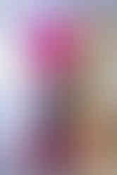 Malibu Dana dancing in front of pink butterfly sculpture