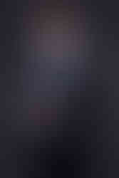 A headshot of a man in a suit and glasses. By Jeff B Photography