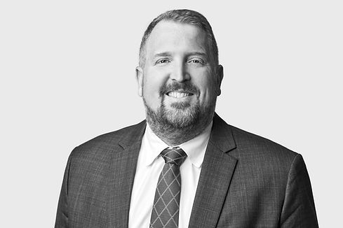 B&W Headshot of a man in a suit