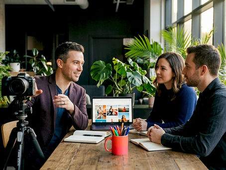 Photographer consulting with clients in branding studio