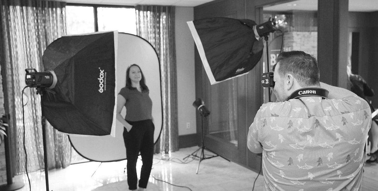 Photographer making a professional headshot at a corporate event