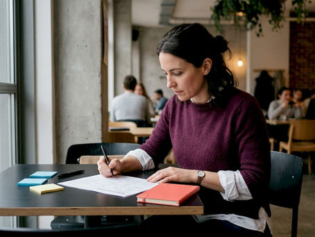 Consultant reviewing brand positioning worksheet