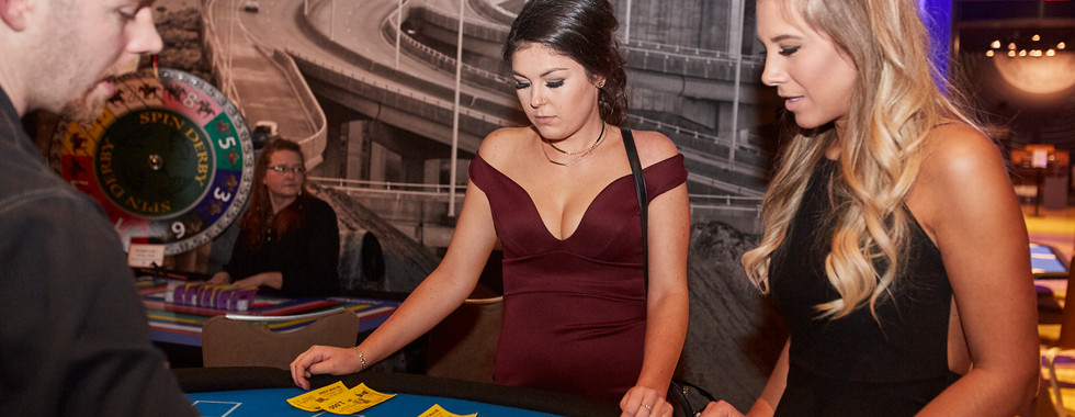 Mock-gambling at casino-themed corporate holiday party.