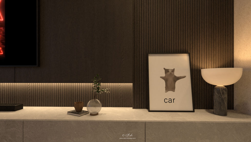 A modern open-concept living and dining area with warm, ambient lighting. The space features a beige sectional sofa with multiple cushions, a black round coffee table, and built-in shelving with decorative objects. The dining area has a long table with six chairs and a sleek black pendant light above it. A ceiling fan is centrally located, and the kitchen is visible through an arched doorway, with dark cabinetry and a Supreme Kermit art piece on the wall. Two bear-shaped sculptures are placed on the floor near the kitchen.
