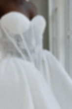 Elegant white strapless wedding dress with sparkling lace corset bodice.