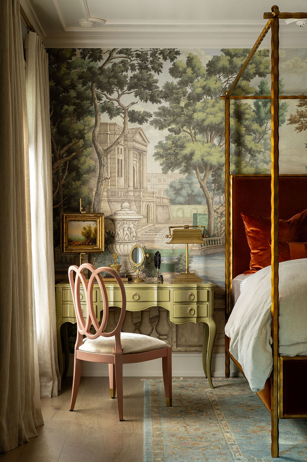 A professional interior designer and a client collaborating in a beautifully designed living room, reviewing fabric swatches and design plans.