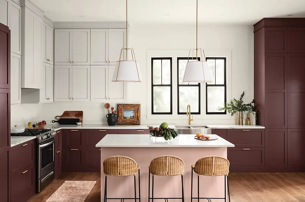 The rosy brown of the lower cabinetry in this kitchen adds a pop of drama, while the white upper cabinets keep the space feeling light and refreshing. Image by Architectural Digest.