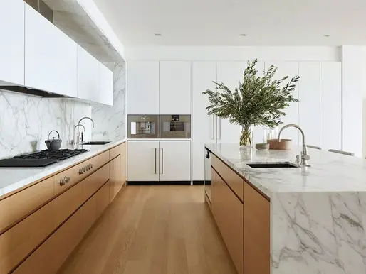 Two-tone minimalistic kitchen by Final Draft Cabinetry.