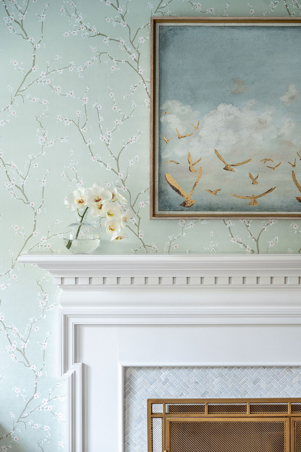 Subtle piece of art over the fireplace on top of beautiful wallpaper.