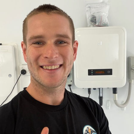 Jacob in front of completed inverter replacement in BliBli