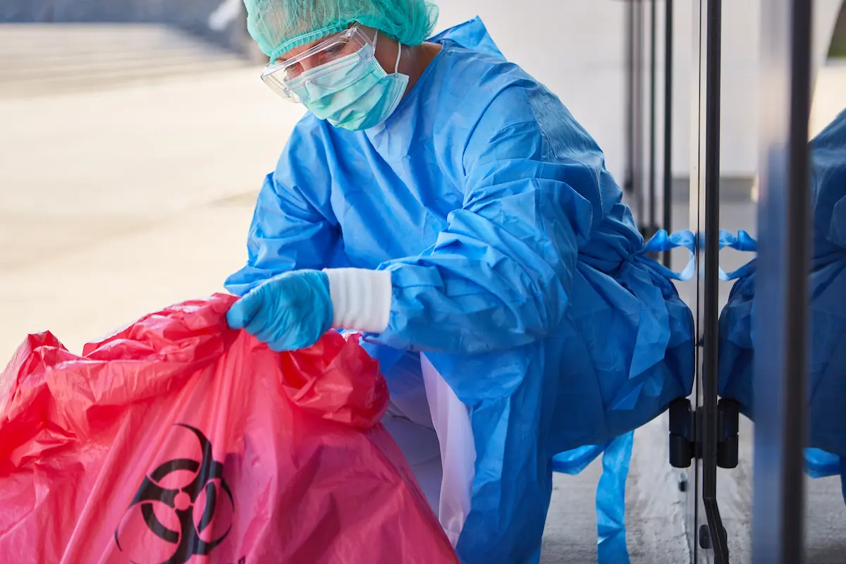 biohazard cleanup professional removing biohazard waste