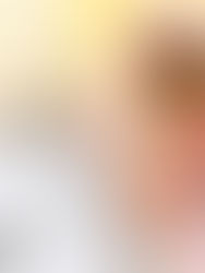 Overwhelmed woman covering ears next to alarm clock representing a stressful morning routine not working.