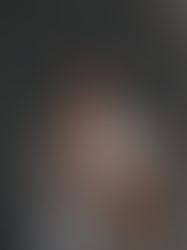 Woman covering her face in front of a broken mirror representing the signs of self-abandonment and emotional disconnection.