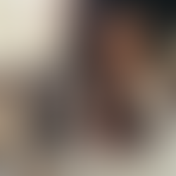 Thoughtful woman at a desk pausing to reflect, representing decision-making skills and how to make better decisions without second-guessing yourself.