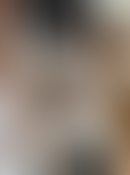 Woman working on a laptop and journaling in a calm home setting, representing personal growth planning, goal setting, mindset development, and intentional living for women.