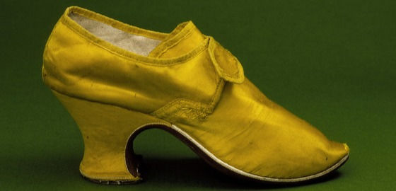 !8th century footwear women fashion history Also called the "Louis" heel, after King Louis XIV, the French heel, was of mid-height, features a curved "waist," with a flare at the bottom. The front side of the heel (the "breast"), under the arch of the foot, has an inward curve, and the sole covers the breast, the arch, and down under the ball of the foot, in one piece.