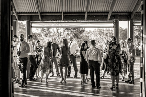 a black and white photo of a group of family and friends gathering
