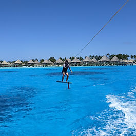 Try wake foiling on Bora Bora's crystal lagoon. Step-by-step coaching gets most riders flying in a single session. Private boat, up to 6 people.