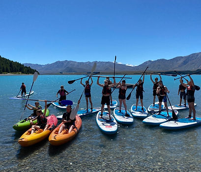 group of kayakers and SUP on Lake Tekapo