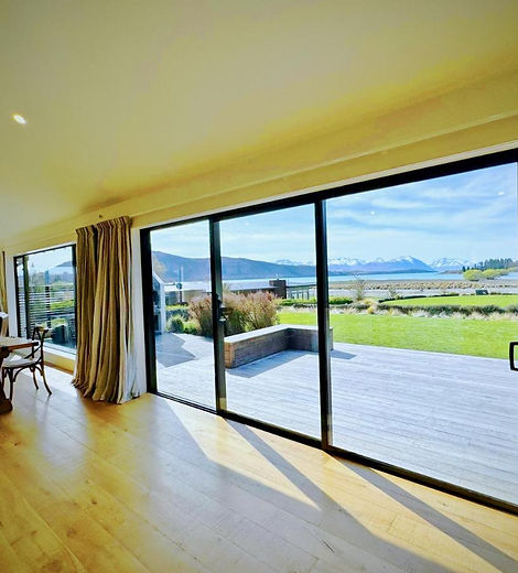 Living area opening to the deck with lake views at Cedar Lakeview, Lake Tekapo
