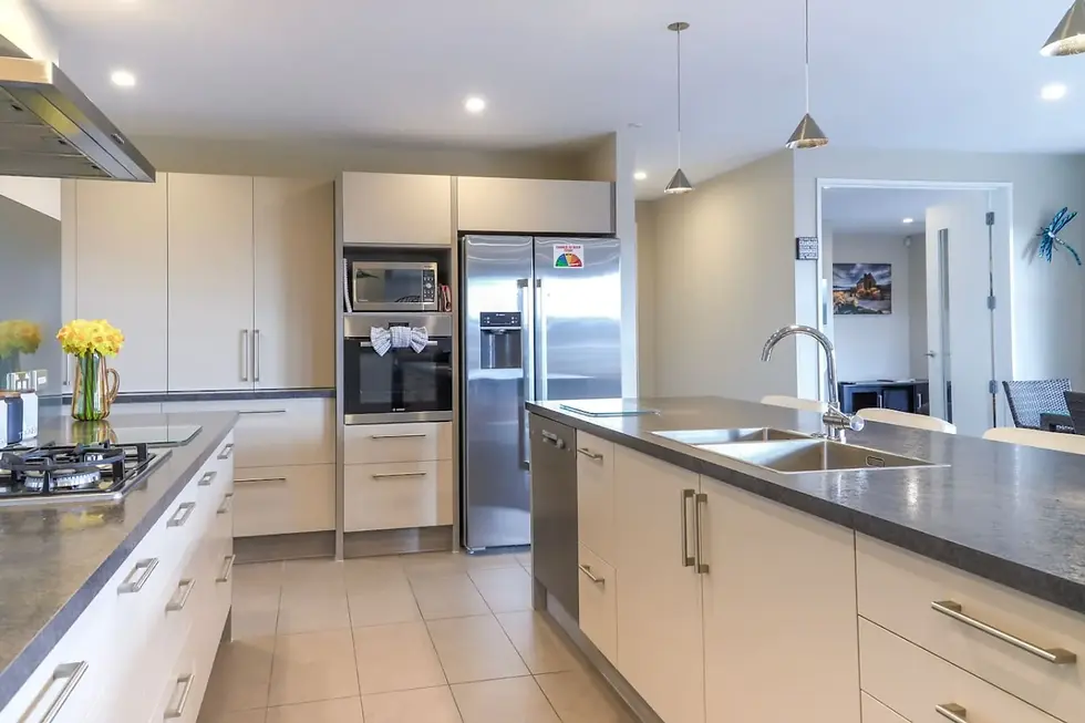 Modern kitchen with gas hob and island bench at The Star Yard, Lake Tekapo
