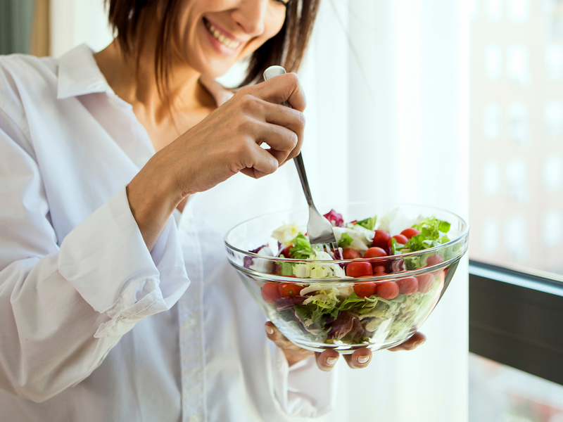 Lady eating a salad for lunch
