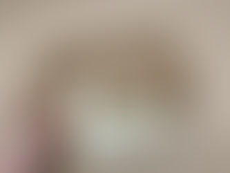 Triumph Spitfire headrest showing new and original beige vinyl