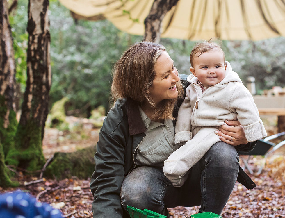 A baby is taken care in in a forest school