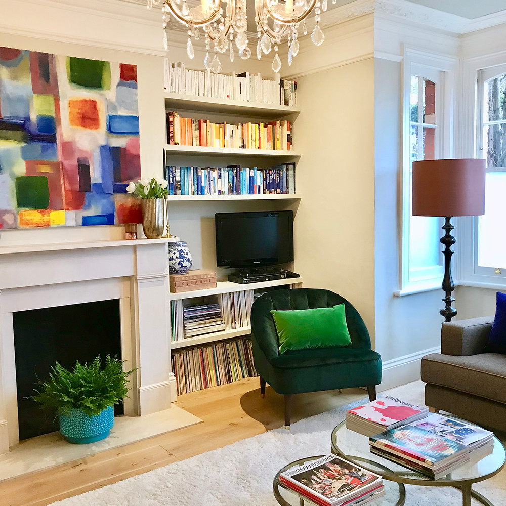 Victorian front room. Colour styled bookcases.