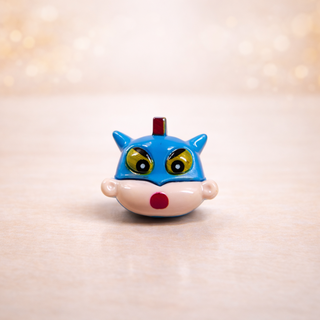 Shinchan fridge magnet miniature with colorful design and expressive eyes on soft aesthetic background