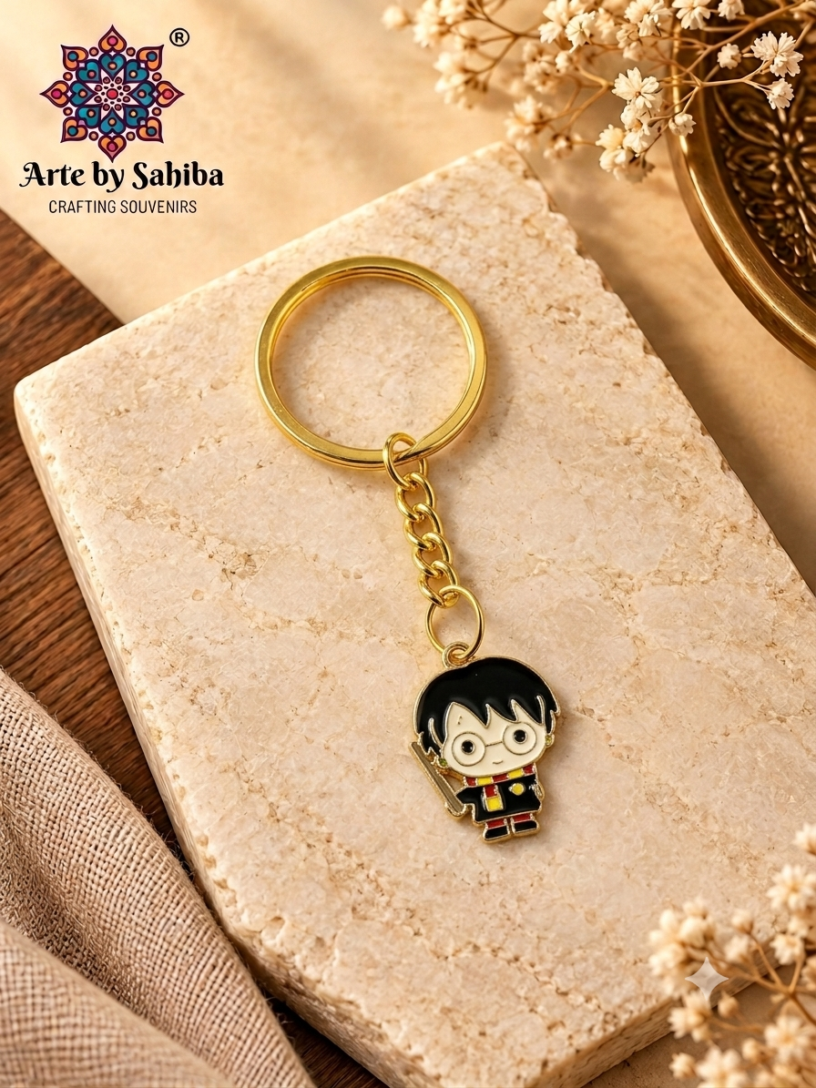 Harry Potter chibi wizard enamel metal keychain holding wand on a gold chain