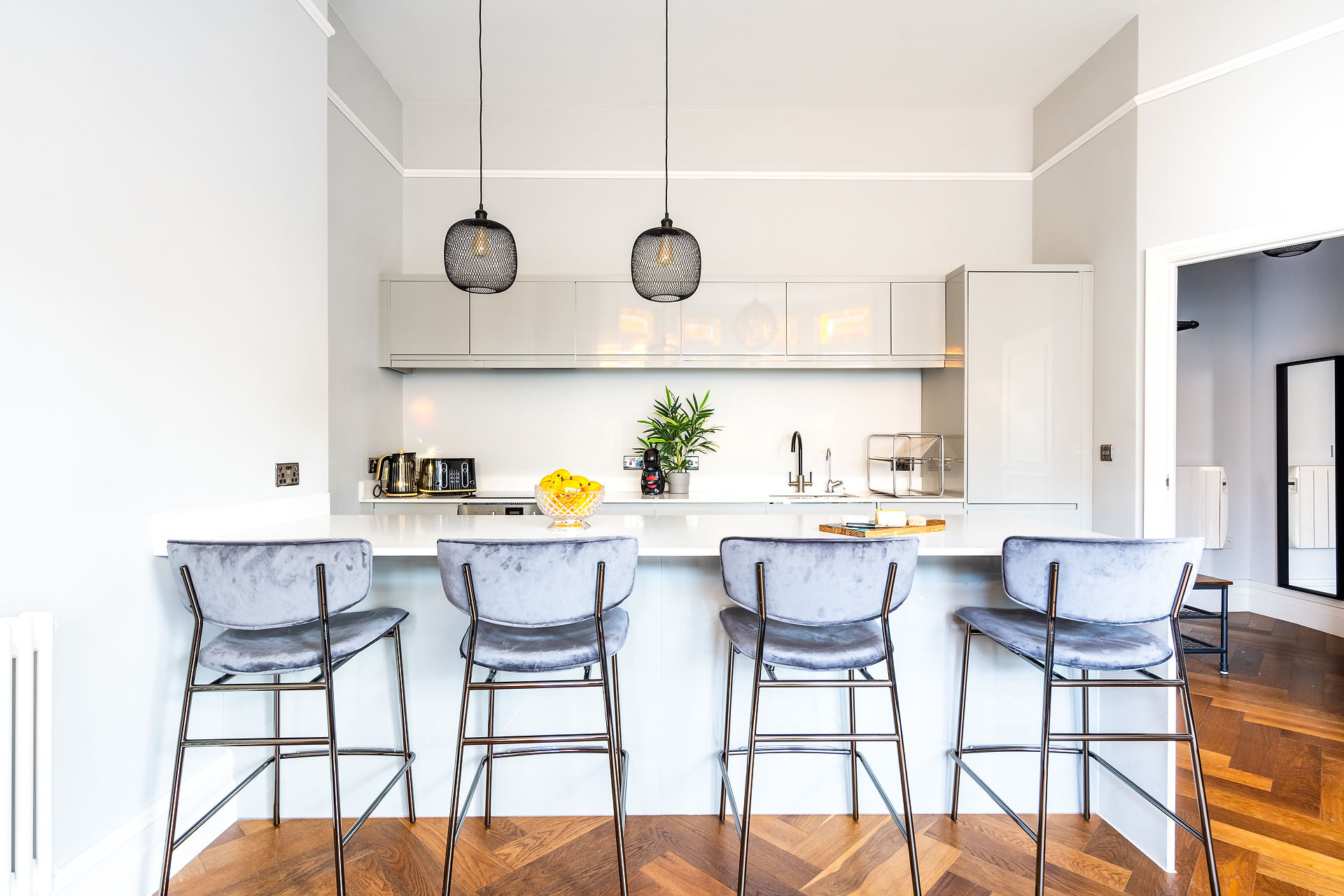 Spacious breakfast bar with seating area, adorned with modern decor and a cozy ambiance.