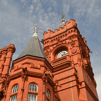 An elegant shot displaying the historic Pierhead Building, an architectural gem in Cardiff Bay, characterized by its distinctive red brick and stunning clock tower.