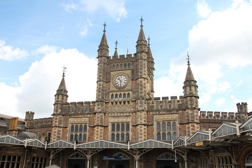 Bristol Cathedral exterior, displaying its intricate stonework and towering spires against a cloudy sky
