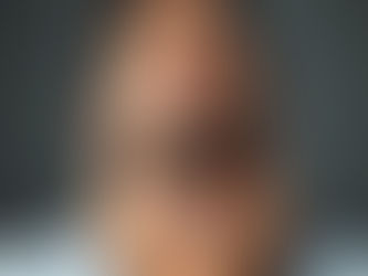 A man resting his hands on his neck, eyes closed, releasing tension — symbolising emotional and physical healing through homeopathy