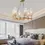 Thumbnail: Elegant chandelier illuminates a modern bedroom with a large window and bed.