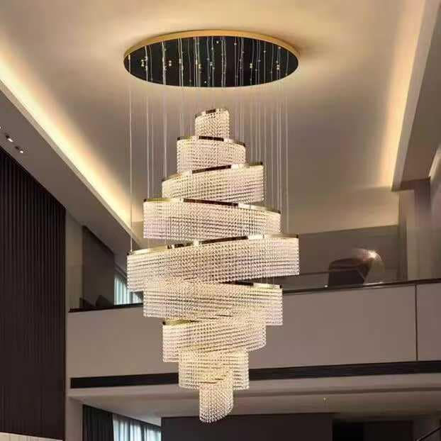 A stunning spiral crystal chandelier elegantly illuminates a modern, high-ceilinged room, adding a touch of luxury and sophistication.