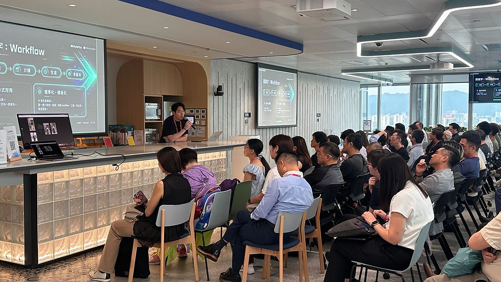 Presenter speaks at a counter to seated audience during a Workflow talk, with Chinese slides and city views in a modern room.