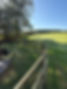 Curved fence in a field