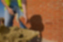Man cementing bricks_edited.jpg