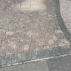Dirty driveway before being pressure washed